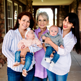 Grandmother, mother, aunt and twins snuggled in for a photo in Highlands Ranch, Colorado.